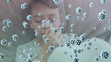 Animation-of-virus-cells-over-caucasian-boy-sneezing-in-bed