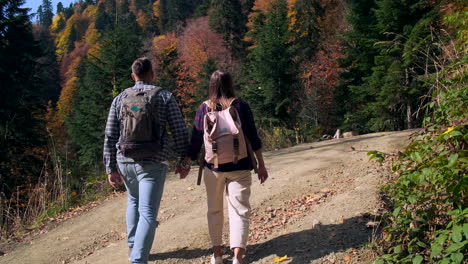 couple hiking in autumn mountains