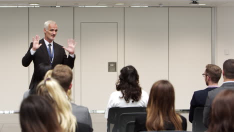 businessman making presentation at conference shot on r3d