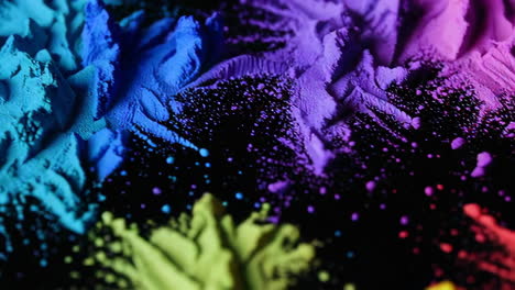 colorful powder explosion on black background
