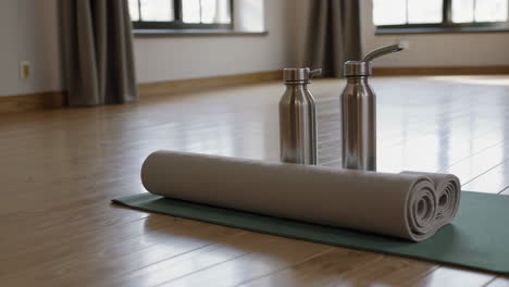yoga mat and water bottles in a studio