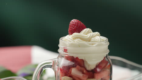 Garnishing-dessert-with-fresh-small-strawberry