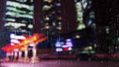 night city through wet glass