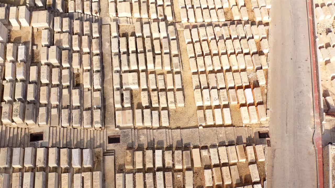 Aerial View of a Cemetery with Rows of Gravestones