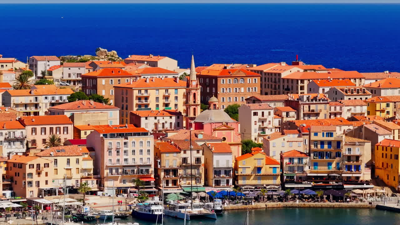 Close up aerial drone shot over the town of Calvi, Corsica, France