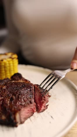 sliced steak with corn