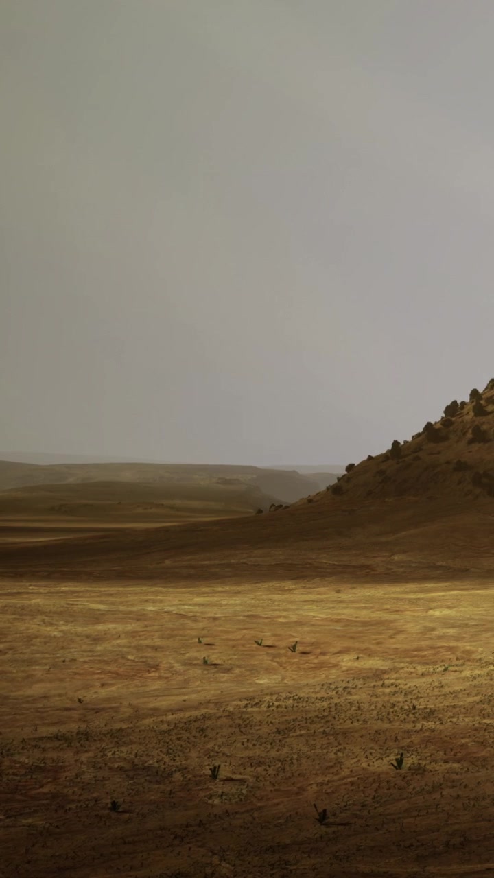 Wide view of a barren landscape with hills under a cloudy sky at dusk
