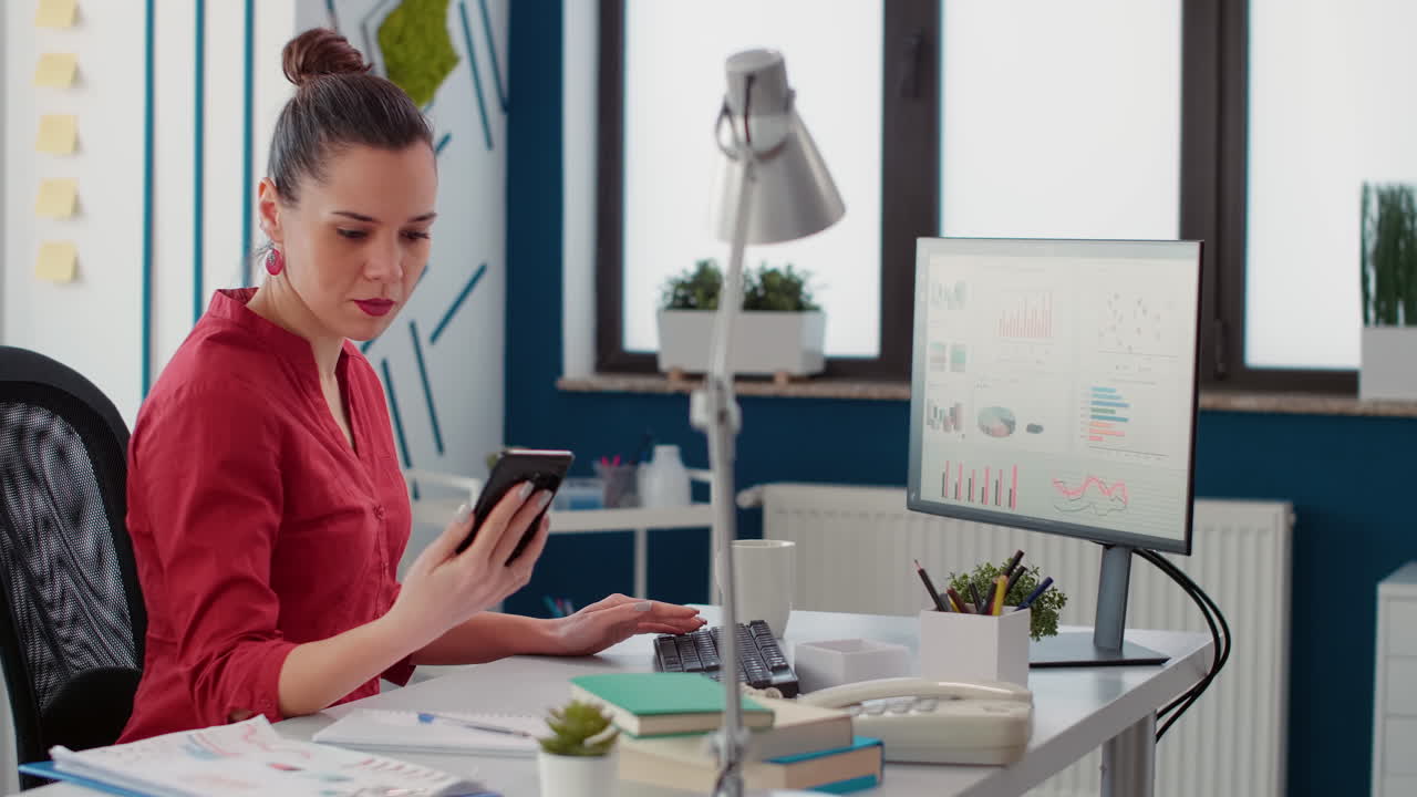 Sales consultant checking text message on smartphone