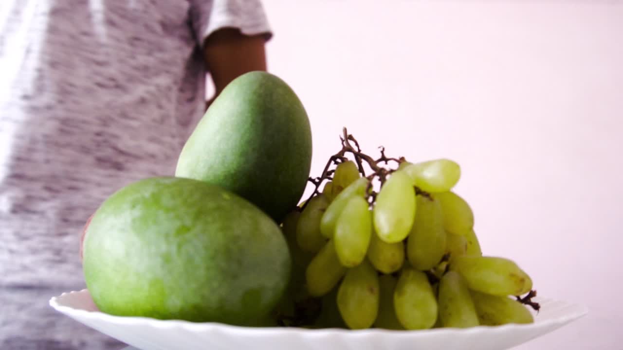 Man making fruit salad at home