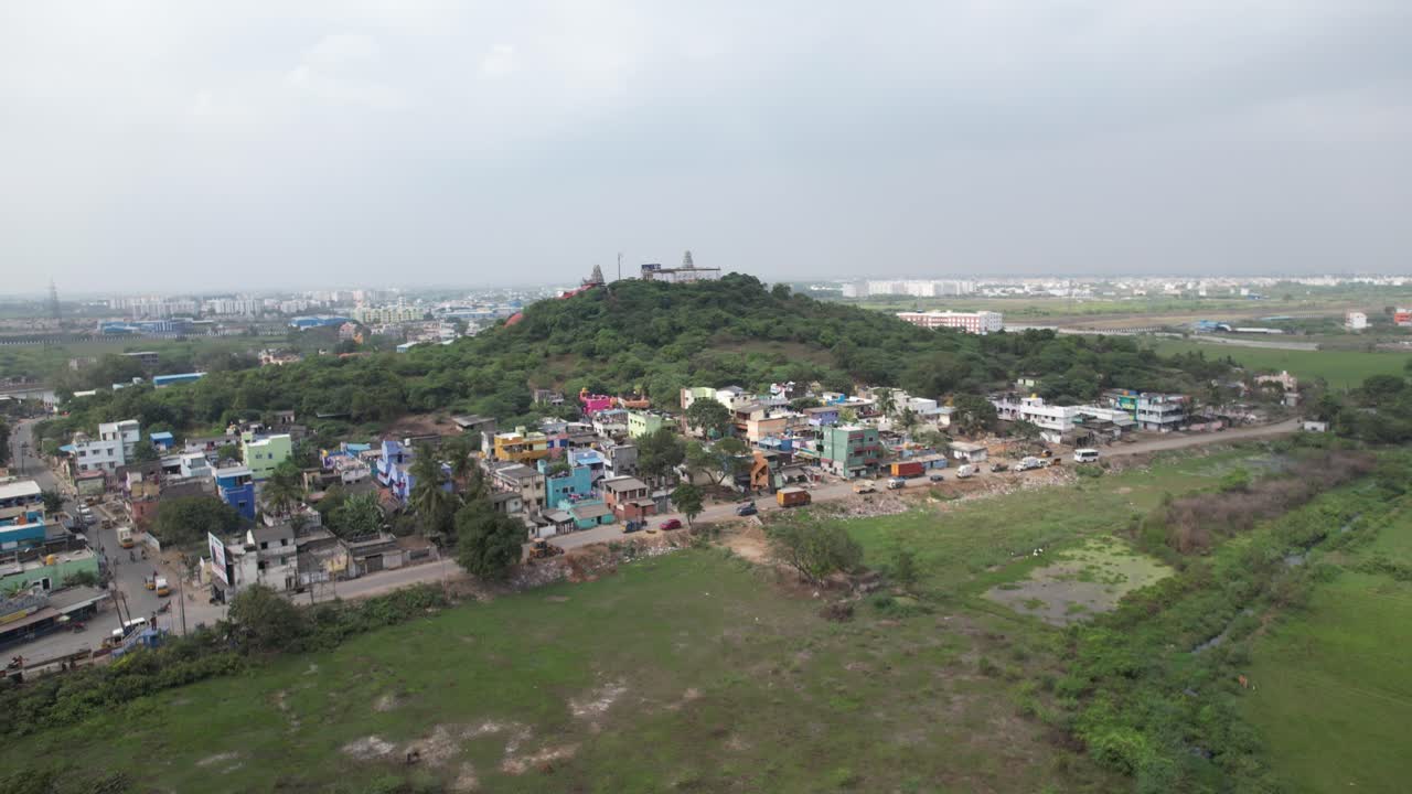 Aerial Shot of Hill in Indian City Surrounded by Houses