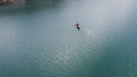 people kayaking on a serene lake