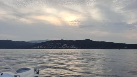 jebel musa mountain is seen from a distance from boat swimming in the water of gibraltar