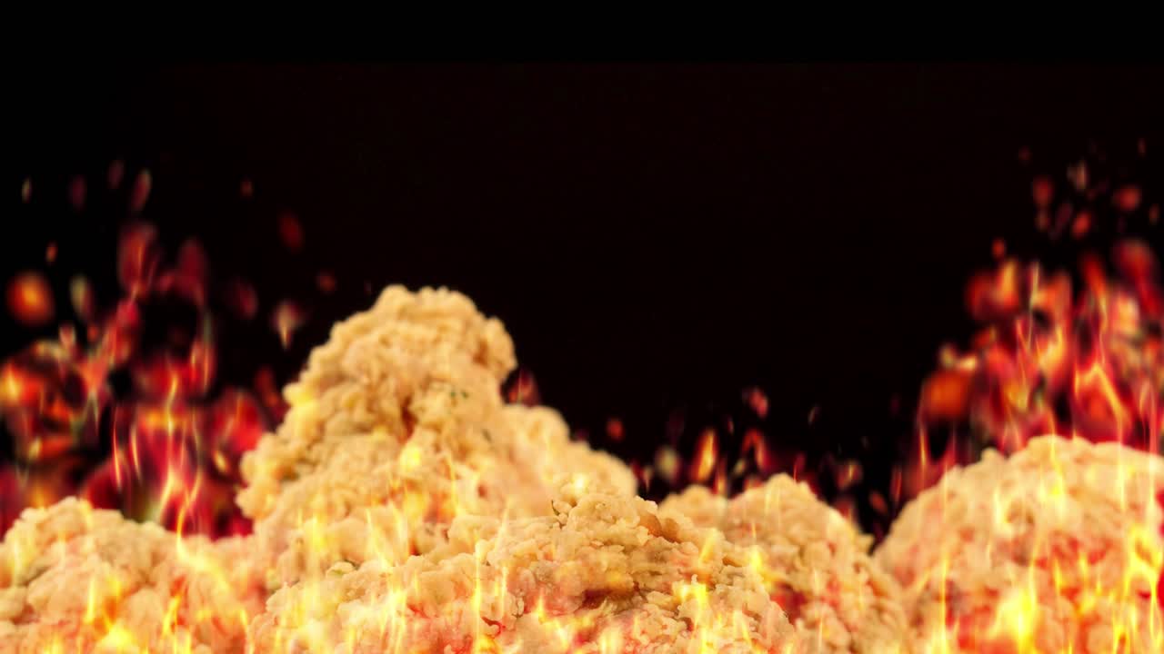 Golden fried chicken pieces appear in front of dynamic, realistic flames. The animation uses smooth transitions, vivid lighting, and a dramatic, energetic mood