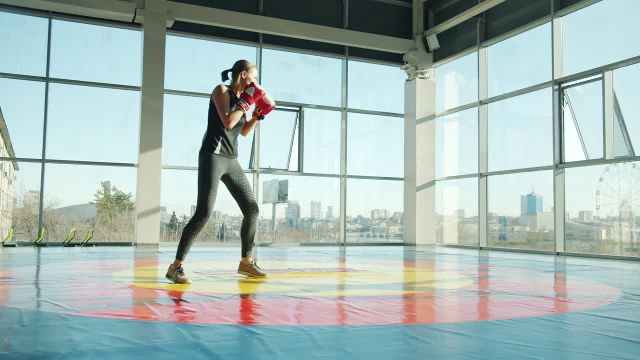 Woman Boxing Training in a Gym
