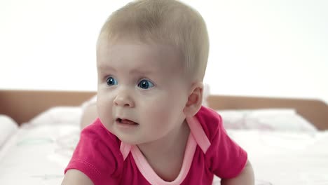 little pretty baby playing on the changing table 1