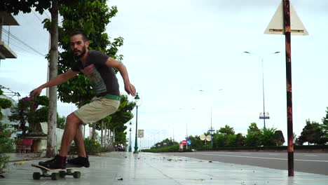 skateboarding, man rides skateboard and doing carving and turning tricks in the street