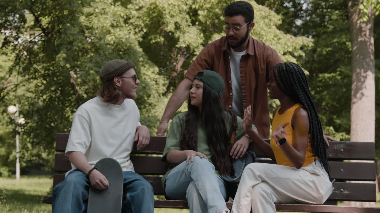 A diverse group of friends socializing in a park