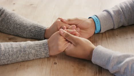 young romantic mixed race couple excited nervous holding hands