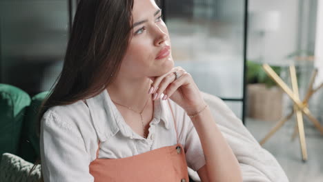 portrait of a thoughtful woman indoors