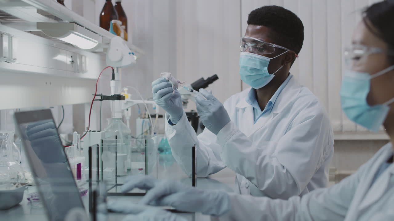 Scientists Doing Experiment in Lab