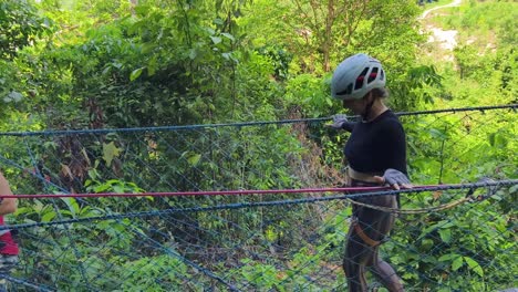 couple ziplining through the jungle