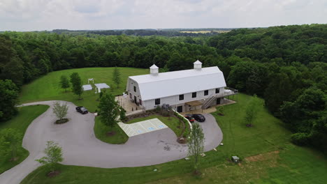 aerial over barn that has been converted upscale wedding venue, 4k