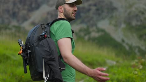 portrait of a hiker with backpack trekking on mountain trails