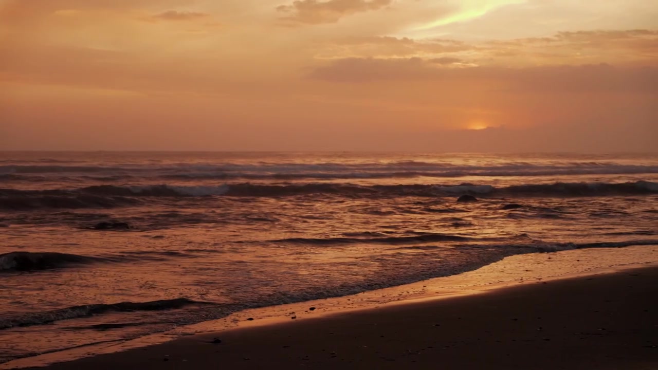 Golden Sunset Over Tropical Beach With Gentle Waves