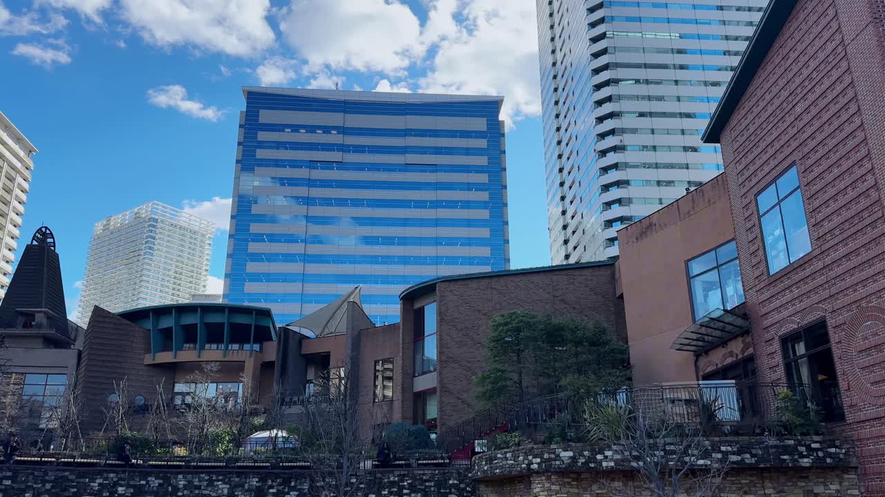 Modern cityscape in Harumi, Tokyo with contemporary buildings under a bright sky