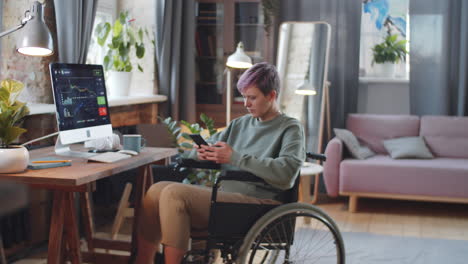 woman in wheelchair working from home