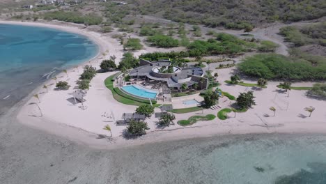 waterfront luxury resort structure with swimming pool at puntarena, bani in dominican republic