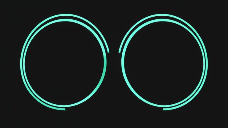Abstrakt animation af glødende cyan cirkler, der udvider sig på sort baggrund.
