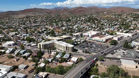 aerial view of globe arizona, drone panning around downtown, mountains with white clouds in sky