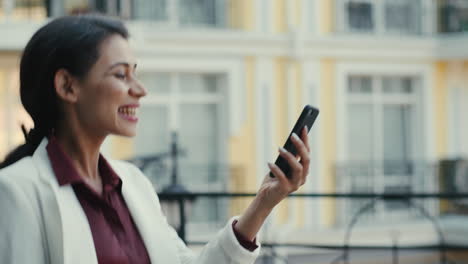 mixed race woman having video chat outside. businesswoman calling outdoors