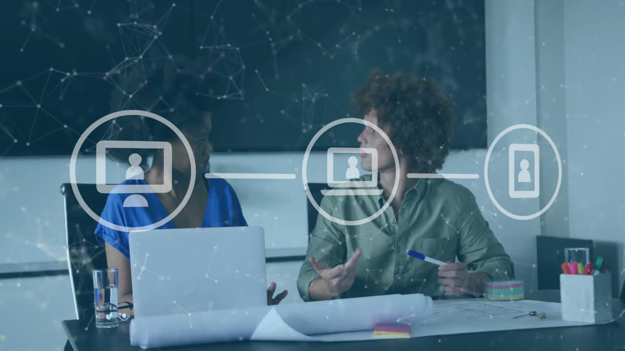 Animation of shapes and media icons over diverse business people discussing work