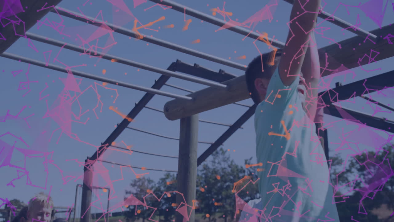 Children playing on monkey bars with colorful geometric animation overlay