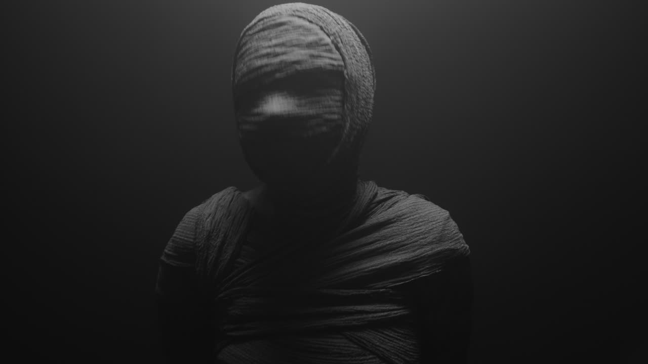 A mummy of a woman on a dark backdrop rises her head
