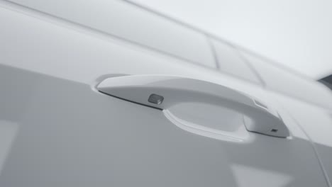 close-up of a white car door handle