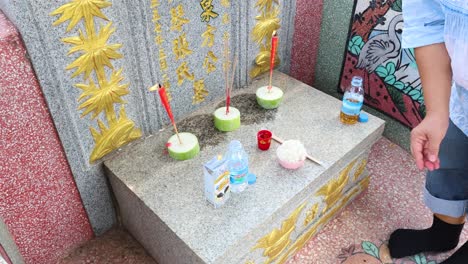 ritual of placing incense at a grave site