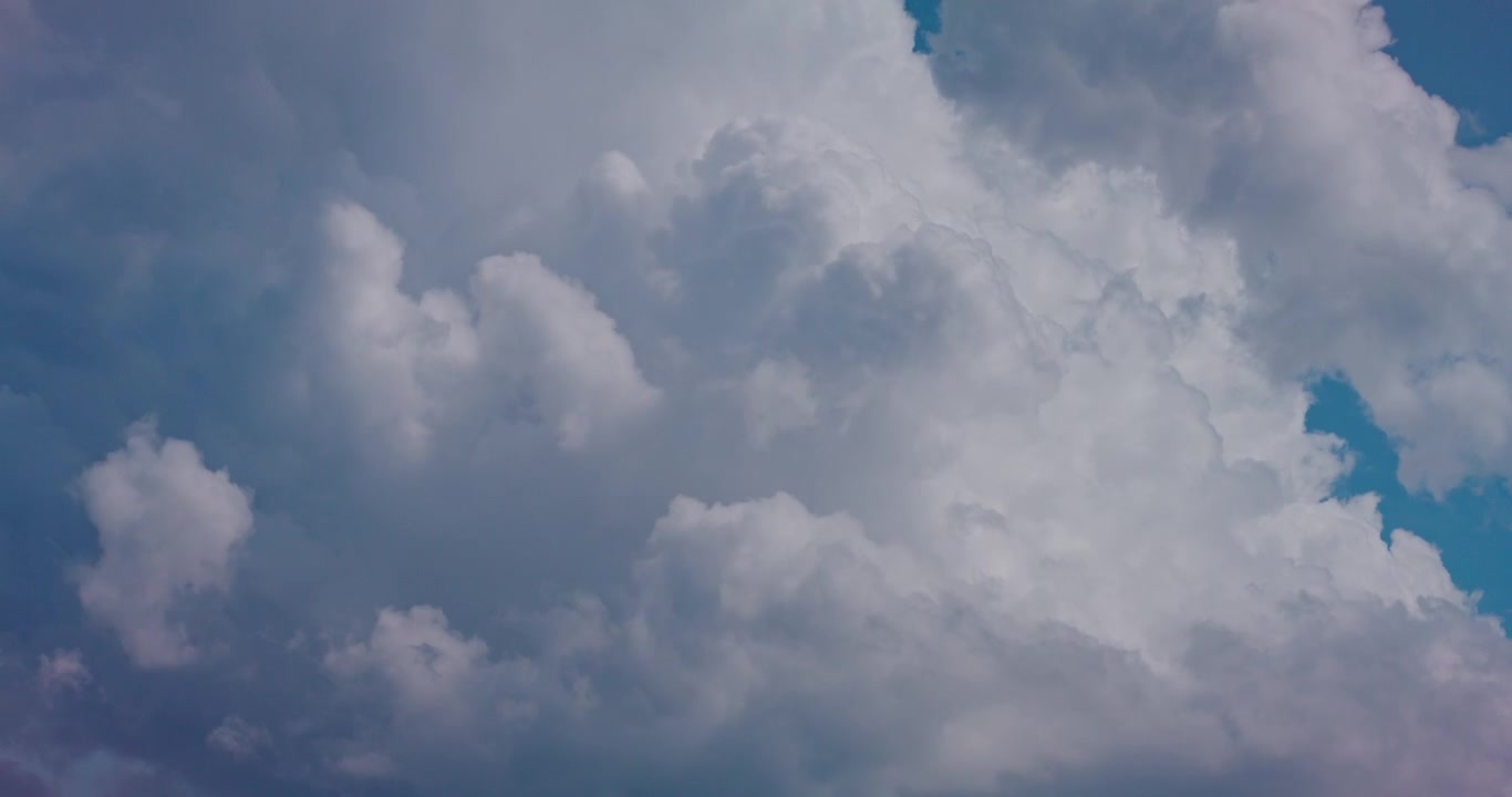 Time-Lapse of White Cumulus Clouds Moving Across a Blue Sky