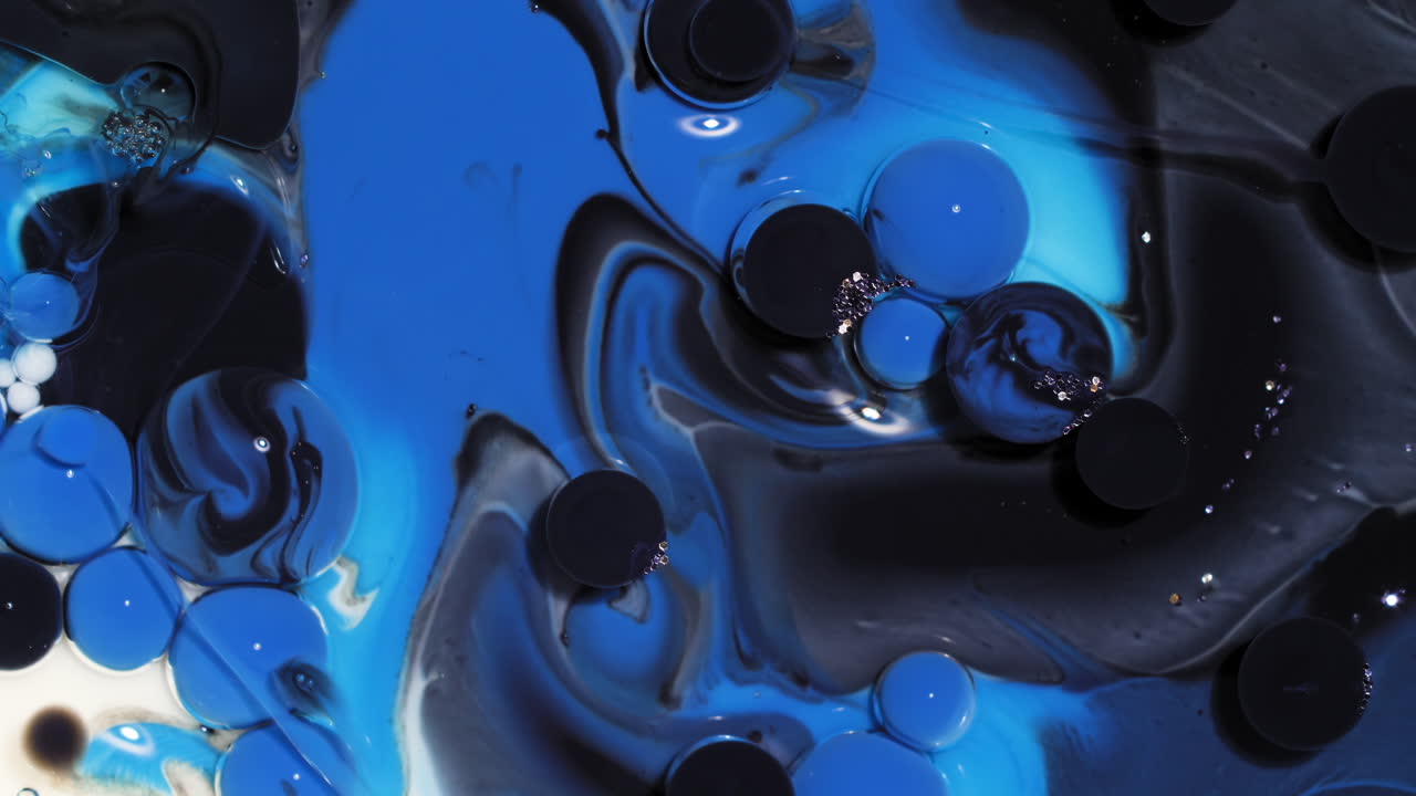 fondo de arte abstracto de burbujas de pintura negra y azul estallar y reaccionar