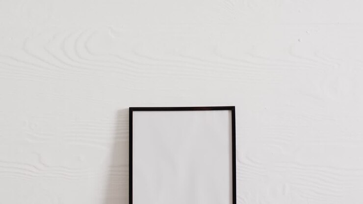 Black frame with copy space on white background and white wall