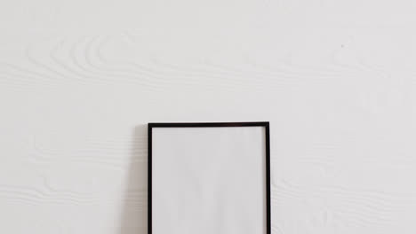 Black-frame-with-copy-space-on-white-background-and-white-wall