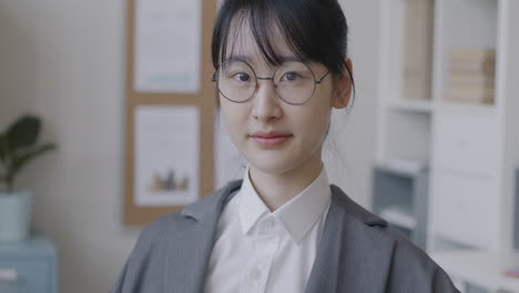 portrait of a young woman in an office