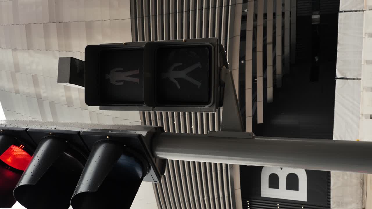 Green pedestrian walk light cross road turning from green to red