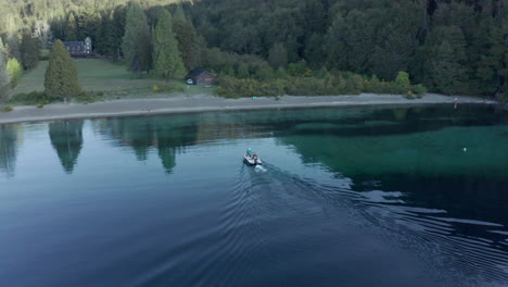 AERIAL---Espejo-Lake-and-forest,-Neuquen,-Patagonia,-Argentina,-forward-approach