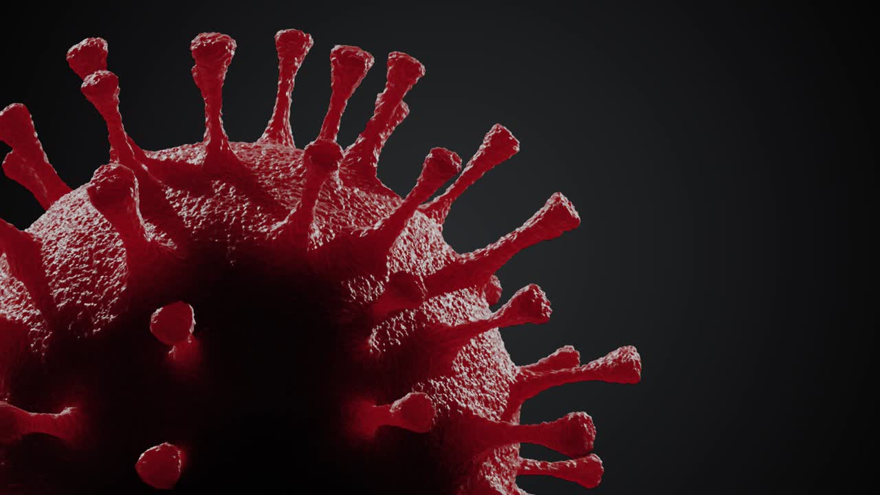 Virus che ruota su sfondo nero. Animazione in loop.
