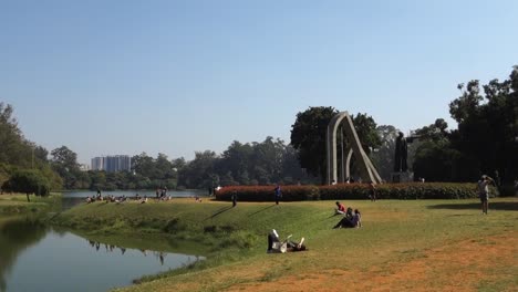 people enjoying the sunny day at ibirapuera park, in sao paulo, brazil. handheld shot, panoramic.