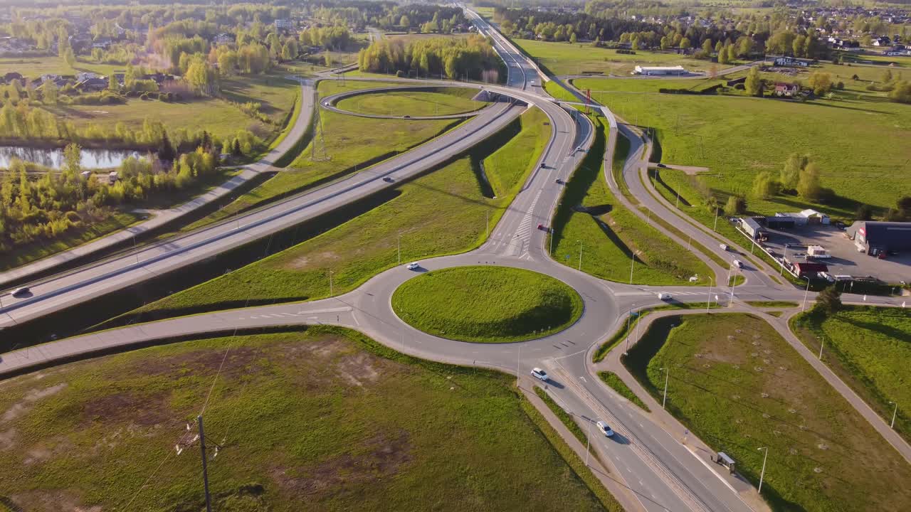 Traffic Circulation At Katlakalns Roundabout From Above In Latvia. Aerial Pullback Shot