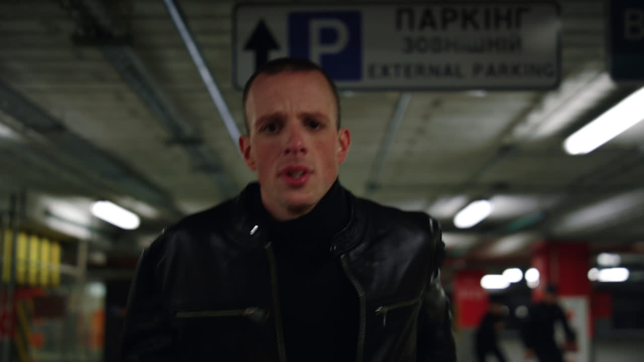 Man in a Parking Garage with Credit Sequence